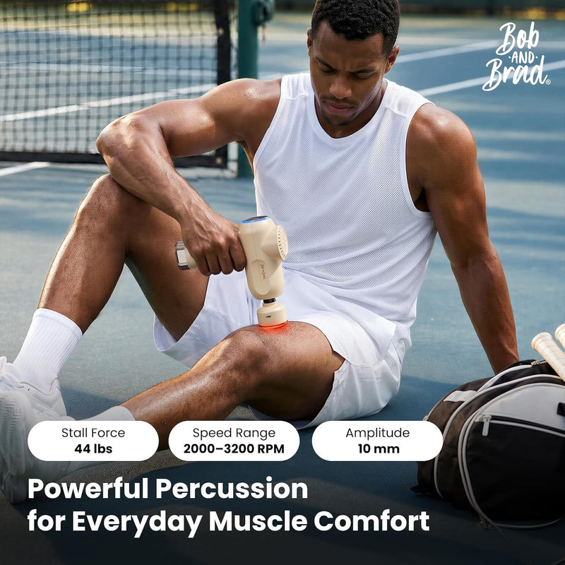Athlete using the Bob and Brad C2 Ultra Massage Gun with heated attachment on his thigh. Features 44 lbs of stall force, 2,000–3,200 RPM, and 10mm amplitude for deep tissue percussion massage.