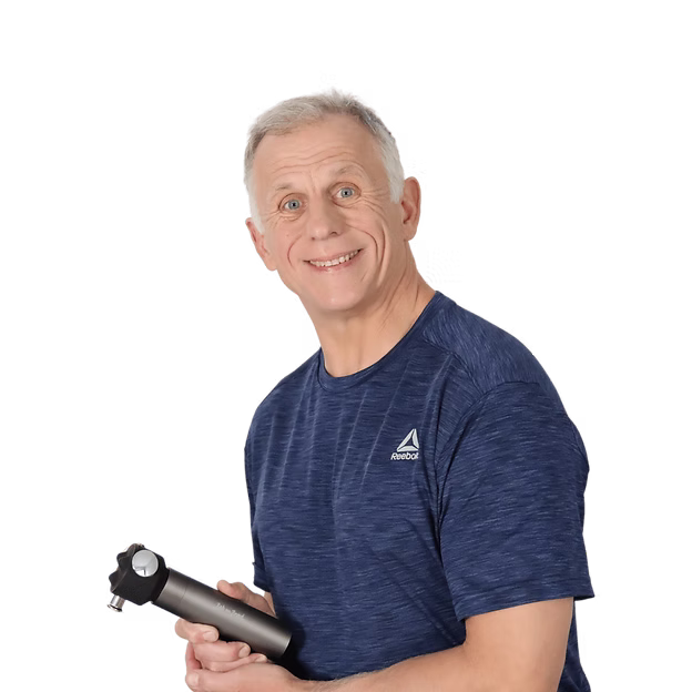 Brad is smiling and wearing a blue heathered Reebok athletic T-shirt, holding a black and silver G100 VibeFlow massager against a solid white background.