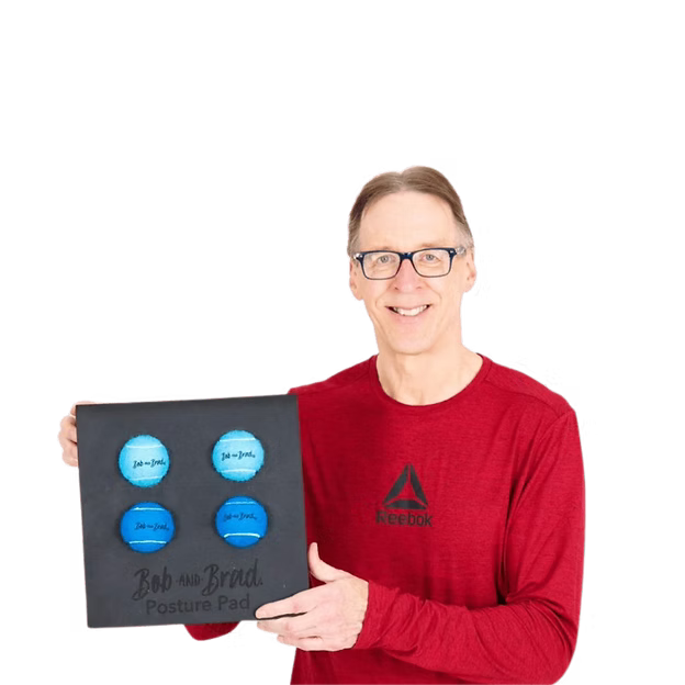 Bob is holding a product labeled 'Bob and Brad Posture Pad' wearing a red shirt.