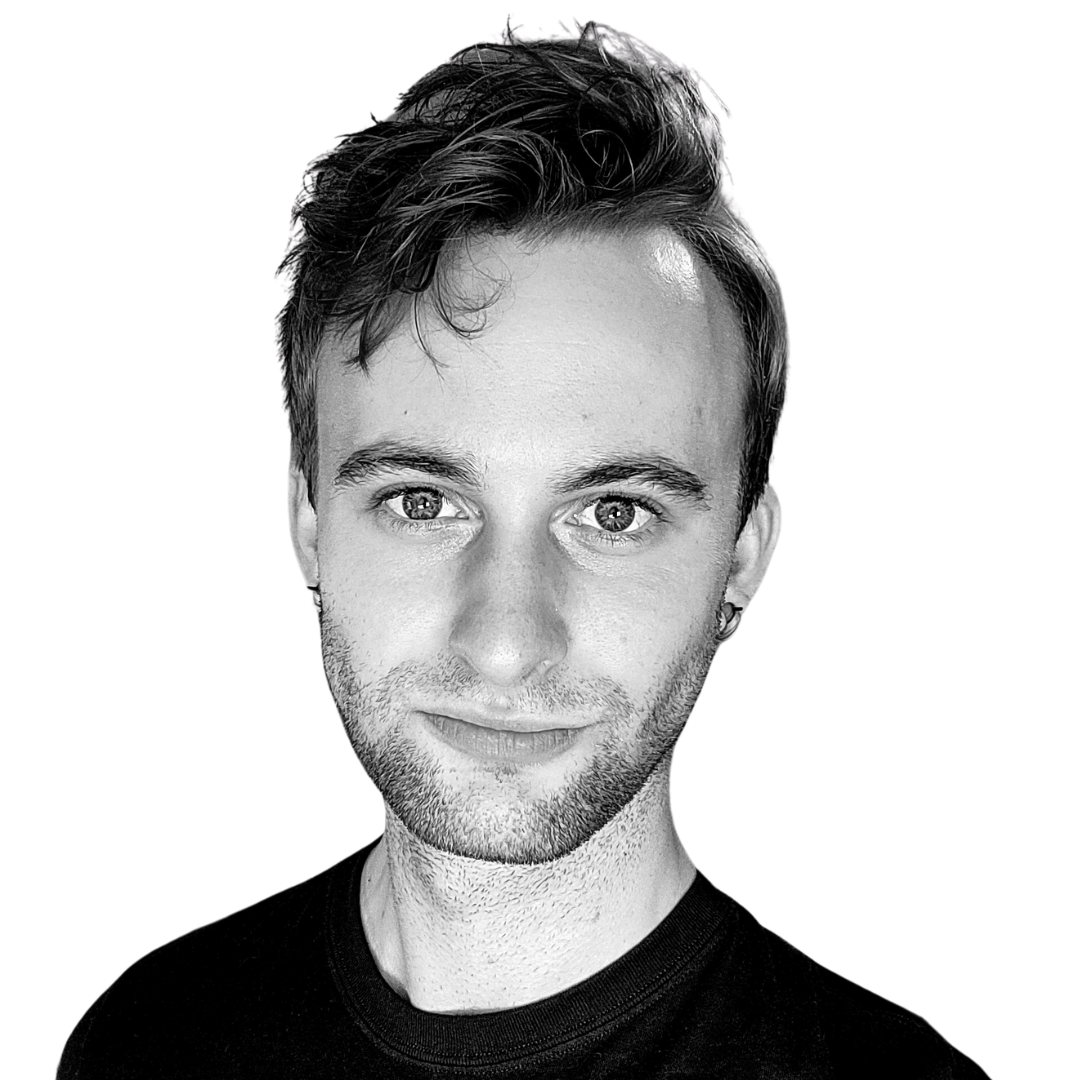 A black and white portrait of Danny, a young man with short, styled hair, wearing a dark crew-neck T-shirt against a plain white background.