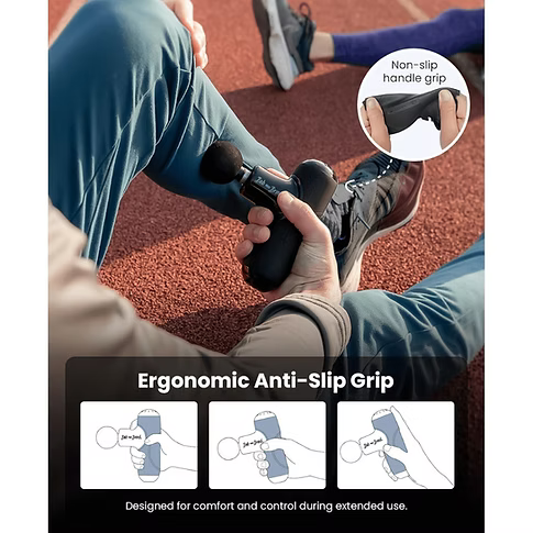A black handheld massage gun being used on a person's lower leg on an outdoor running track. The image includes a circular inset showing the non-slip handle grip and three small diagrams at the bottom illustrating the ergonomic anti-slip grip design.