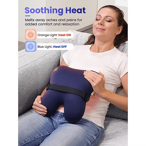 A woman is reclining on a gray couch with a dark blue back massager lying on her stomach. The image includes promotional text reading 'Soothing Heat' and light indicators for orange (heat on) and blue (heat off).