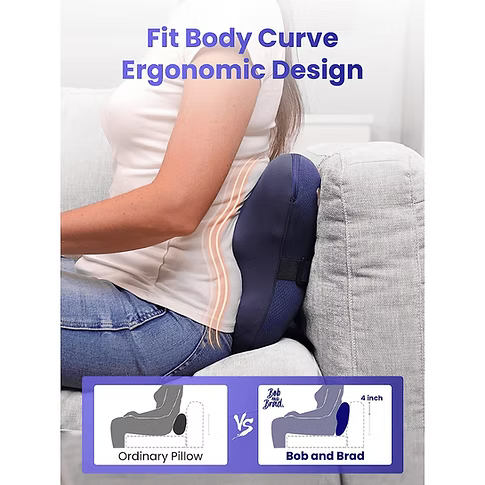 A person sitting on a light gray couch uses a dark navy back massager. The image includes marketing text reading 'Fit Body Curve Ergonomic Design' and a comparison graphic at the bottom showing an ordinary pillow versus the Bob and Brad brand ergonomic pillow.